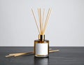 Reed Diffuser with Blank Label on Dark Table Royalty Free Stock Photo