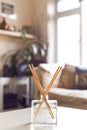 Reed diffuser to fragrance home interior on the coffee table of a light modern home living room