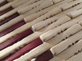 Reed or wood mat. The rug is a mat under the hot. Knitted processed wood sticks with rounded edges. Close-up. Yellow, brown and Royalty Free Stock Photo