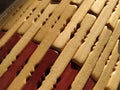 reed or wood mat. The rug is a mat under the hot. Knitted processed wood sticks with rounded edges. Close-up. Yellow  brown and Royalty Free Stock Photo