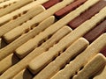 reed or wood mat. The rug is a mat under the hot. Knitted processed wood sticks with rounded edges. Close-up. Yellow  brown and Royalty Free Stock Photo