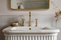 A reeded marble bathroom sink with a gold faucet. Royalty Free Stock Photo