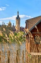 Reeds and wooden boathouse on Lake Schwerin with castle in the background Royalty Free Stock Photo