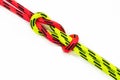 Reef, Hercules, square, double or brother hood Binding knot binding two colored red and green ropes. nautical loop Royalty Free Stock Photo