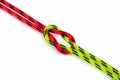 Reef, Hercules, square, double or brother hood Binding knot binding two colored red and green ropes. nautical loop Royalty Free Stock Photo