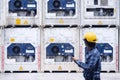 Reefer technician is taking care of reefer container at the port while working with tablet to monitor Frozen and Chill Royalty Free Stock Photo