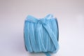 Reel of blue velvet ribbon for wrapping gifts and flowers with a bow