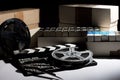 Reel with film and cinema clap Royalty Free Stock Photo