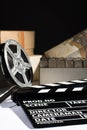 Reel with film and cinema clap Royalty Free Stock Photo