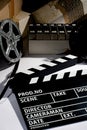 Reel with film and cinema clap Royalty Free Stock Photo