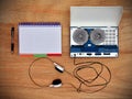 Reel tape recorder and blank notepad Royalty Free Stock Photo