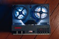 reel to reel audio tape recorder with blue led light strip