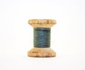 Reel or wood spool of sewing thread isolated on white. Royalty Free Stock Photo