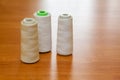 Reels with white threads for a sewing machine in atelier Royalty Free Stock Photo
