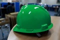 reen safety helmet complete with suspension and chin strap