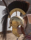 Reenactor holds a rome republican helmet