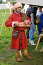 Reenactor man plays the harp