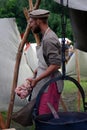 Reenactor man shows his skills, he cooks