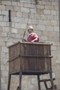 Reenactor over watchtower of a roman camp