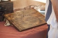 Reenactor reading annual roman calendar and zodiac