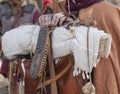 Reenactor roman soldier holds marching pack