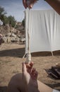 Reenactor using spindle with clay whorl