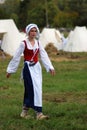 Reenactor woman portrait. She walks and looks at camera.