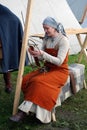 Reenactor woman shows her skills