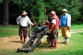 Reenactors demonstrate the firing of a cannon