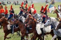 Reenactors dressed as Napoleonic war French soldiers ride horses