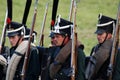 Reenactors dressed as Napoleonic war soldiers holding guns