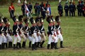 Reenactors dressed as Napoleonic war soldiers march on the battle field Royalty Free Stock Photo