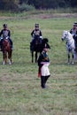 Reenactors dressed as Napoleonic war soldiers march on the battle field Royalty Free Stock Photo