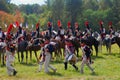 Reenactors dressed as Napoleonic war soldiers march on the battle field Royalty Free Stock Photo