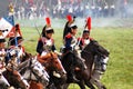 Reenactors dressed as Napoleonic war soldiers ride horses Royalty Free Stock Photo