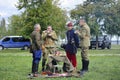 Reenactors dressed in an uniform of retro soldiers having lunch in a city park Royalty Free Stock Photo