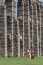 Reenactors women beside Los Milagros Aqueduct, Merida, Spain