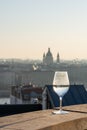 Refelction of St. Stephen basilica in wine glasses and vague silhouette in the background