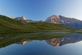 Reflections on a mountain lake at sunrise Royalty Free Stock Photo