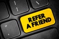 Refer a Friend text button on keyboard, concept background