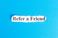 REFER A FRIEND text on paper. Word REFER A FRIEND on torn paper. Concept Image Royalty Free Stock Photo