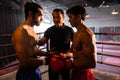 Two Muay Thai boxer with strong muscular body on the ring ready to fight.Impetus Royalty Free Stock Photo