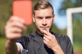 Referee on football field showing red card Royalty Free Stock Photo