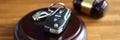 Referee gavel and remote control from car on table closeup