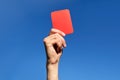 Referee hands with red card on football field Royalty Free Stock Photo