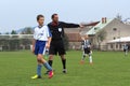 Referee on kids soccer match category U13 Royalty Free Stock Photo