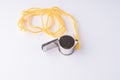 referee's whistle on a yellow string on a white background Royalty Free Stock Photo