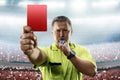 Referee showing the red card in the soccer stadium Royalty Free Stock Photo