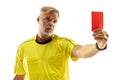 Football referee showing a red card to a displeased player isolated on white background