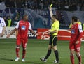 Referee shows the yellow card